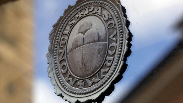 A logo on a window of a Banca Monte dei Paschi di Siena SpA bank branch in Siena, Italy, on Monday, Sept. 20, 2021. After more than 500 years as a pillar of prosperity in the hills of Tuscany and a decade or so as a byword for dysfunction, Banca Monte dei Paschi di Siena SpA appears to be entering the final chapter of its history. Photographer: Alessia Pierdomenico/Bloomberg