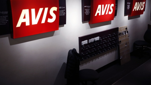 Avis Budget Group Inc. signage is displayed at a rental counter at Louisville International Airport (SDF) in Louisville, Kentucky, U.S., on Tuesday, Feb. 19, 2019. Avis Budget Group Inc. is releasing earnings figures on February 20. Photographer: Luke Sharrett/Bloomberg
