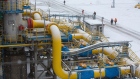Workers walk pipework in the snow-covered yard at the Gazprom PJSC Slavyanskaya compressor station, the starting point of the Nord Stream 2 gas pipeline, in Ust-Luga, Russia, on Thursday, Jan. 28, 2021. Nord Stream 2 is a 1,230-kilometer (764-mile) gas pipeline that will double the capacity of the existing undersea route from Russian fields to Europe -- the original Nord Stream -- which opened in 2011. Photographer: Andrey Rudakov/Bloomberg