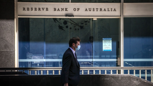 A pedestrian passes the Reserve Bank of Australia (RBA) building in Sydney, Australia, on Monday, Sept. 6, 2021. Australia's central bankers are set to revisit the question of whether to delay a planned taper of bond purchases as a worsening outbreak of the delta variant dims prospects of a rapid economic rebound.