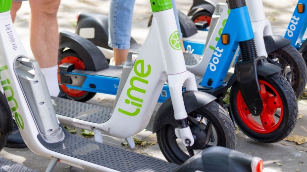 A row of e-scooters on the first day of an e-scooter rental trial in the Kensington and Chelsea district of London, U.K., on Monday, June 7, 2021. Transport for London and London Councils started the trial on June 7, with operators Dott, Lime and TIER, according to an emailed statement.