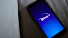 The Disney+ logo on a smartphone arranged in New York, U.S., on Wednesday, Nov. 18, 2020. Though the entertainment titan is still reeling from the pandemic, the growth of Disney+ has softened the blow. Photographer: Gabby Jones/Bloomberg