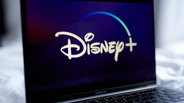The Disney+ logo on a laptop computer arranged in New York, U.S., on Wednesday, Nov. 18, 2020. Though the entertainment titan is still reeling from the pandemic, the growth of Disney+ has softened the blow. Photographer: Gabby Jones/Bloomberg