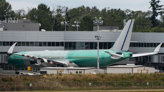 A Boeing Co. 777X airplane sits parked outside of the company's facility in Everett, Washington, U.S., on Friday, July 24, 2020. Boeing is scheduled to release earnings figures on July 29. Photographer: David Ryder/Bloomberg