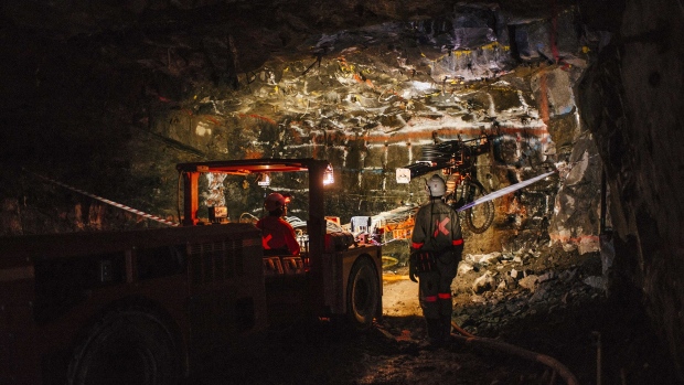 A mining vehicle illuminates the rock face inside the Northam Platinum Ltd. Booysendal platinum mine, located outside the town of Lydenburg in Mpumalanga, South Africa, on Jan. 23, 2018. Photographer: Waldo Swiegers/Bloomberg