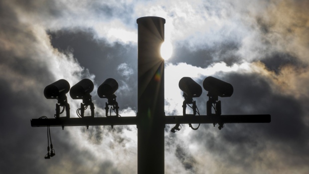 Security surveillance cameras CCTV sit on a pole in London, U.K. Photographer: Bloomberg Creative Photos/Bloomberg