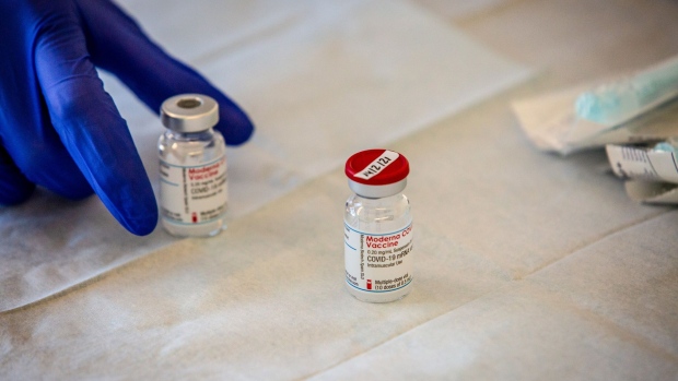 Vials of the Moderna Inc. Covid-19 vaccine at the Sant Joan de deu Hospital in Barcelona, Spain, on Saturday, Jan. 16, 2021. The European Union may secure an extra 50 million doses of the Covid-19 vaccine produced by Moderna as the bloc seeks to accelerate inoculations, according to people familiar with the matter. Photographer: Angel Garcia/Bloomberg