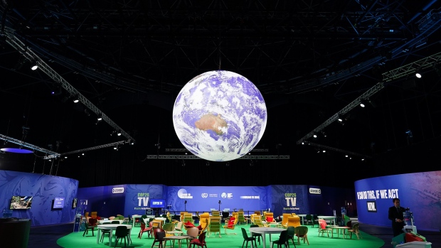 GLASGOW, SCOTLAND - NOVEMBER 12: The Earth hangs over an Action Zone in the OVO Hydro building on day thirteen of the COP26 at SECC on November 12, 2021 in Glasgow, Scotland. This is the 26th "Conference of the Parties" and represents a gathering of all the countries signed on to the U.N. Framework Convention on Climate Change and the Paris Climate Agreement. The aim of this year's conference is to commit countries to net-zero carbon emissions by 2050. (Photo by Ian Forsyth/Getty Images)