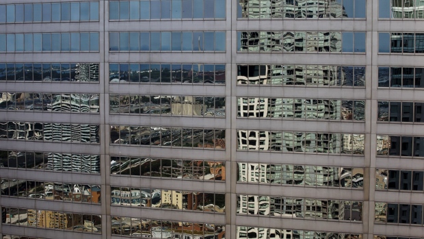 Buildings are seen reflected in the financial district of Toronto, Ontario, Canada, on Thursday, July 25, 2019. Canadian stocks fell as tech heavyweight Shopify Inc. weighed on the benchmark and investors continued to flee pot companies.