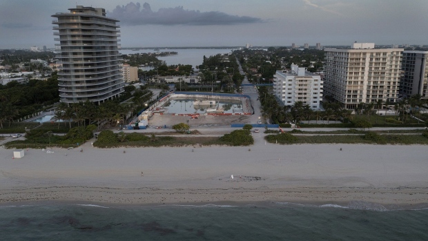 SURFSIDE, FLORIDA - JULY 31: In this aerial view, the cleared lot that was where the collapsed 12-story Champlain Towers South condo building once stood on July 31, 2021 in Surfside, Florida. A total of 98 people died when the building partially collapsed on June 24, 2021. (Photo by Joe Raedle/Getty Images)