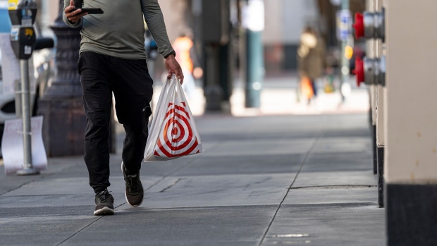 A pedestrian carries a Target Corp. branded shopping in San Francisco, California, U.S., on Monday, Mar. 1, 2021. Target Corp. is scheduled to release earnings figures on March 2. Photographer: David Paul Morris/Bloomberg