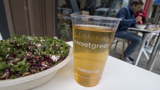A salad and drink are arranged for a photograph outside a Sweetgreen Inc. restaurant in San Francisco, California, U.S., on Tuesday, May 16, 2017. Sweetgreen, a hip lunch joint, has opted for plastic over paper as trend pieces have been quick to dub card-only payment the next big thing and to pillory cash as dead.