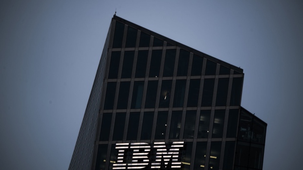 A logo sits illuminated on the International Business Machines Corp. (IBM) Watson cognitive computing platform Internet of Things (IoT) center, at the IoT center in Munich, Germany, on Thursday, Aug. 10, 2017. IBM is revamping its Global Technology Services division, which helps customers run their computer networks, to rely more heavily on artificial intelligence. Bloomberg