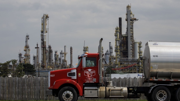 A truck passes a Suncor Energy Inc. oil refinery near the Enbridge Line 5 pipeline in Sarnia, Ontario, Canada, on Tuesday, May 25, 2021. Enbridge Inc. said it will continue to ship crude through its Line 5 pipeline that crosses the Great Lakes, despite Michigan Governor Gretchen Whitmer's order to shut the conduit.