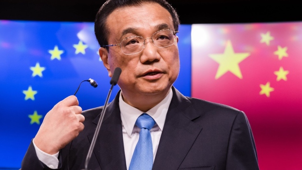 Li Keqiang, China's premier, removes his earpiece as he speaks during a news conference at of the EU-China summit at the Europa building in Brussels, Belgium, on Tuesday, April 9, 2019. The EU and China managed to agree on a joint statement for Tuesday’s summit in Brussels, papering over divisions on trade in a bid to present a common front to U.S. President Donald Trump, EU officials said.