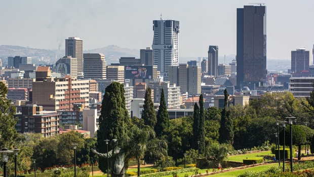 The South African Reserve Bank, South Africa's central bank, right, stands on the skyline in Pretoria, South Africa, on Tuesday, June 4 2019. South Africa’s central bank won’t bail out the country’s troubled state-owned companies including power utility Eskom Holdings SOC Ltd. because it would fuel inflation, Governor Lesetja Kganyago said.