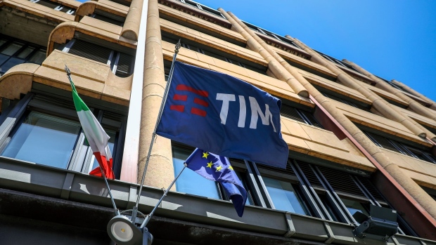 The TIM logo on a flag above an entrance to the Telecom Italia SpA headquarters building in Rome, Italy, on Monday, May 17, 2021. Telecom Italia report results on Wednesday. Photographer: Alessia Pierdomenico/Bloomberg