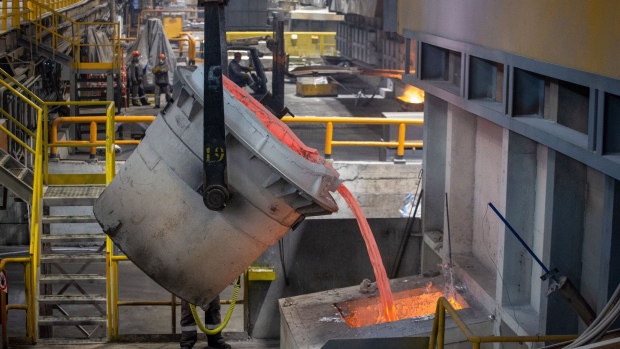 A crucible pours molten aluminium into a smelter on the large aluminum slabs production line in the foundry at the Sayanogorsk Aluminium Smelter, operated by United Co. Rusal, in Sayanogorsk, Russia, on Wednesday, May 26, 2021. United Co. Rusal International PJSC’s parent said the company has produced aluminum with the lowest carbon footprint as the race for cleaner sources of the metal intensifies.