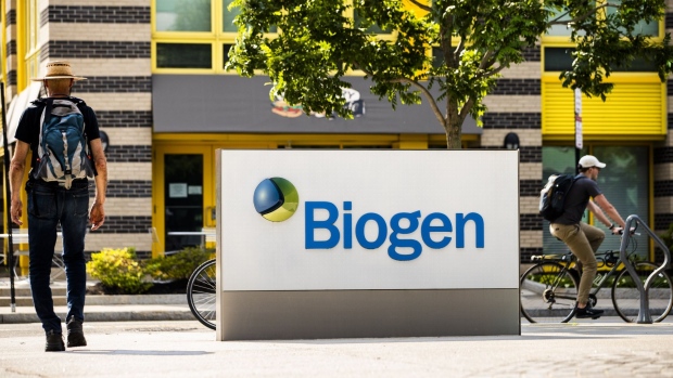A pedestrian walks past Biogen Inc. headquarters in Cambridge, Massachusetts, U.S., on Monday, June 7, 2021. Biogen Inc. shares soared after its controversial Alzheimer's disease therapy was approved by U.S. regulators, a landmark decision that stands to dramatically change treatment for the debilitating brain condition.