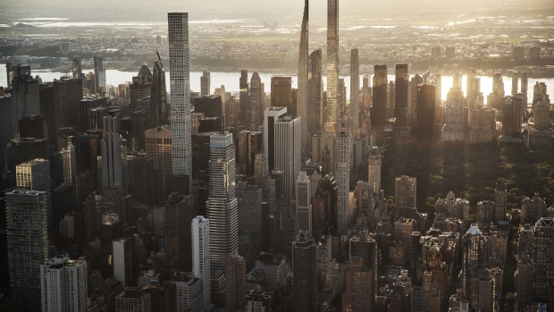 Buildings in the Manhattan skyline in New York, U.S., on Thursday June 17, 2021. New York state's pandemic mandates were lifted last week, after 70% of the adult population has now been given at least one dose of a coronavirus vaccine. Photographer: Victor J. Blue/Bloomberg