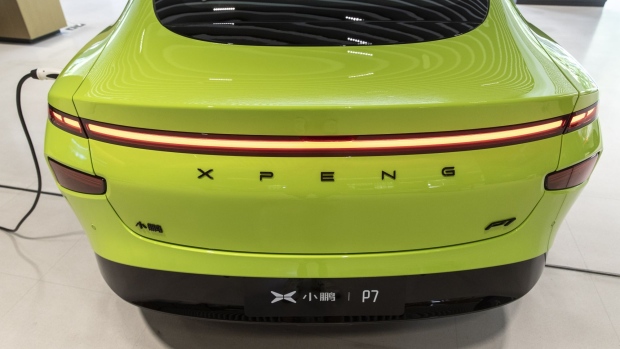 The XPeng Inc. P7 Wing Limited Edition electric vehicle at an XPeng dealership in Shanghai, China, on Monday, July 5, 2021. Electric-vehicle maker XPeng has raised about HK$14 billion ($1.8 billion) in its Hong Kong listing, becoming the first Chinese EV producer to finish a so-called homecoming share sale. Photographer: Qilai Shen/Bloomberg