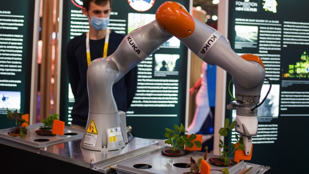 A robotic arm tends to plants on the Kuka AG exhibition stand at the Viva Technology conference at Porte de Versailles exhibition center in Paris, France, on Wednesday, June 16, 2021. Viva Tech runs June 16 - 19.