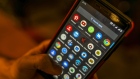 A smartphone displays application icons for Pinterest Inc., from top left, Google LLC's YouTube, Facebook Inc.'s WhatsApp, Messages and Google Chrome in an arranged photograph taken in Mumbai, India, on Saturday, Feb. 15, 2020. Facebook, YouTube, Twitter and TikTok will have to reveal users' identities if Indian government agencies ask them to, according to the country’s controversial new rules for social media companies and messaging apps expected to be published later this month. Photographer: Dhiraj Singh/Bloomberg