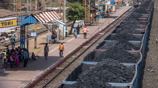 Freight wagons laden with coal sit at the Tori station on the Tori-Shivpur rail line, operated by Indian Railways and funded by Coal India Ltd., in Chandwa, Jharkhand, India, on Thursday, May 17, 2018. State miner Coal India's output and shipments jumped to seasonal records in June, buoyed by summer demand from power stations, the company's biggest customers. Photographer: Prashanth Vishwanathan/Bloomberg