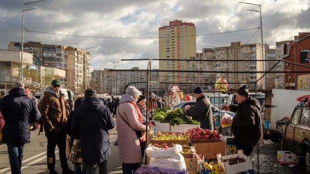 Shoppers visit a weekly street market in Troieshchyna, one of the poorest sections of the city in Kiev, Ukraine, on Saturday, Nov. 20, 2021. For Russia's President Vladimir Putin, Ukraine is unfinished business after his annexation of Crimea in 2014 and he sees Ukraine as part of Russia and bristles at its outreach with the west, especially its nascent military engagement with NATO. Photographer: Christopher Occhicone/Bloomberg