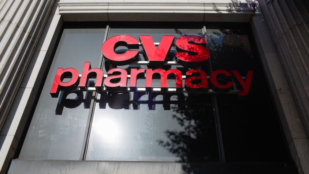 CVS Health Corp. signage is displayed outside a store in downtown Los Angeles, California, U.S., on Friday, Oct. 27, 2017. The prospect of Amazon.com Inc. entering the healthcare business is beginning to cause far-reaching reverberations for a range of companies, roiling the shares of drugstore chains, drug distributors and pharmacy-benefit managers, and potentially precipitating one of the biggest corporate merger deals this year. Photographer: Christopher Lee/Bloomberg