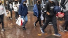 Pedestrians carry shopping bags on Market Street in San Francisco, California, U.S., on Monday, Nov. 1, 2021. U.S. holiday sales this year will surge 8.5% to 10.5% from 2020 to reach as much as $859 billion, according to the National Retail Federation. Photographer: David Paul Morris/Bloomberg