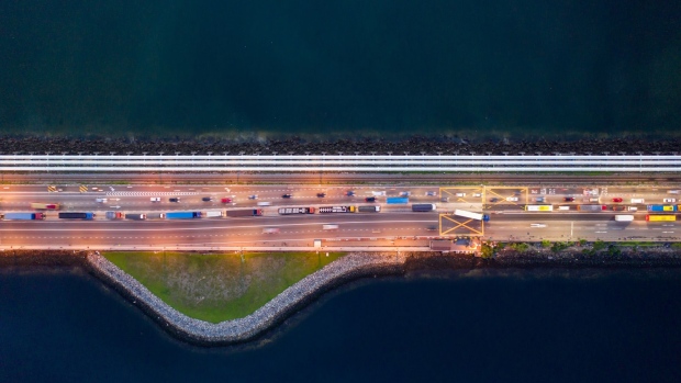 Vehicles travel along the Causeway across the Straits of Johor at dawn in this aerial photograph taken above Johor Bahru, Johor, Malaysia, on Thursday, June 20, 2019. Malaysia's Prime Minister Mahathir Mohamad said he underestimated the challenges of governing the country before his shock election victory last year. “I underestimated because we were on the outside and we didn’t get any information on what was happening on the inside,” Mahathir said.