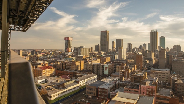 Commercial properties, residential buildings and skyscraper offices on the skyline viewed from a rooftop bar in Johannesburg, South Africa, on Thursday, May 21, 2021. Traders raised bets that South Africa’s central bank will tighten policy this year after inflation accelerated more than expected, resulting in a negative real interest rate for the first time in more than five years. Photographer: Guillem Sartorio/Bloomberg