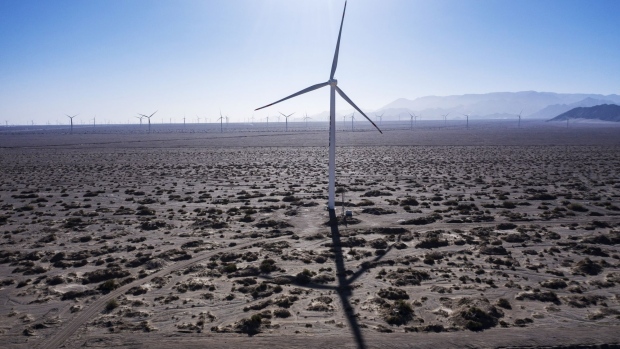 Turbines at a wind farm near near Golmud, Qinghai province, China, on Saturday, Sept. 11, 2021. China is opening up its market for trading green energy, making it easier for multinationals from BMW AG to Airbus SE to buy wind and solar power and reach aggressive emissions goals.