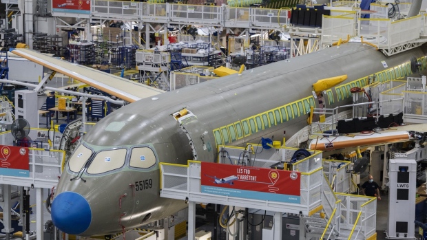 An Airbus A220 at the Airbus Canada LP assembly and finishing site in Mirabel, Quebec, Canada, on Wednesday, Nov. 17, 2021. Air Lease Corp. is seeing demand for single-aisle jets like Airbus SE's A320neo and A220 families outstrip the planemakers' current rates of manufacturing.