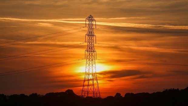 An electricity transmission tower during sunset near Bradwell on Sea, U.K. Photographer: Chris Ratcliffe/Bloomberg