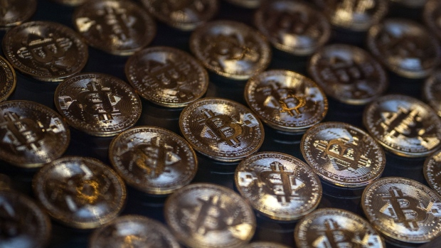 Illustrative bitcoin tokens in the window of a cryptocurrency exchange kiosk in Istanbul, Turkey, on Monday, Nov. 8, 2021. Bitcoin and Ether hit all-time highs in a cryptocurrency rally that some analysts attributed partly to the search for a hedge against inflation.