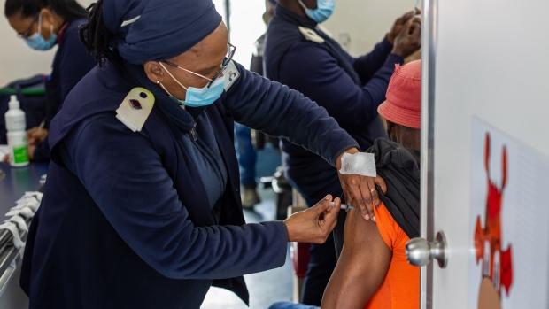 A health worker administers a dose of the Johnson & Johnson Covid-19 vaccine to a resident onboard a pop-up vaccination bus in Cape Town, South Africa, on Thursday, Aug. 26, 2021. South Africa is the worst hit nation in Africa by the coronavirus, having reported over 78,000 deaths and 2.6 million infections. Photographer: Dwayne Senior/Bloomberg