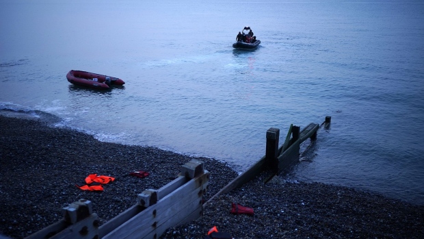 DOVER, ENGLAND - SEPTEMBER 11: An empty migrant dinghy is collected by the Border force off the beach at St Margaret's Bay after the occupants landed from France on September 11, 2020 in Dover, England. More than 1,468 migrants, some of them children, crossed the English Channel by small boat in August, despite a commitment from British and French authorities to step up enforcement. (Photo by Christopher Furlong/Getty Images) Photographer: Christopher Furlong/Getty Images Europe