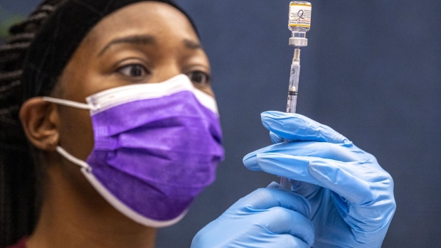 A nurse prepares a pediatric dose of the Pfizer-BioNTech Covid-19 vaccine at a vaccination clinic at an elementary school in San Jose, California, U.S., on Thursday, Nov. 4, 2021. Younger children, ages 5 to 11-year-old, across the U.S. are now eligible to receive Pfizer Inc.'s Covid-19 vaccine, after the head of the Centers for Disease Control and Prevention granted the final clearance needed for shots to begin.