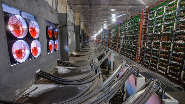 Industrial cooling fans operate to thermally regulate the CryptoUniverse cryptocurrency mining farm in Nadvoitsy, Russia, on Thursday, March 18, 2021. The rise of Bitcoin and other cryptocurrencies has prompted the greatest push yet among central banks to develop their own digital currencies.
