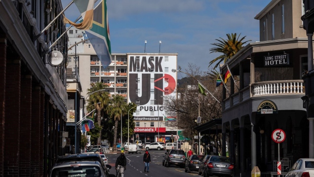 A 'mask up' billboard covers the front of a building on Long Street in Cape Town. Photographer: Dwayne Senior/Bloomberg