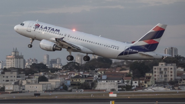 An aircraft operated by Latam Airlines Group SA sit takes off from Congonhas Airport (CGH) in Sao Paulo, Brazil, on Monday, Aug. 9, 2021. Latam Airlines is expected to release earnings figures after-market on August 9.