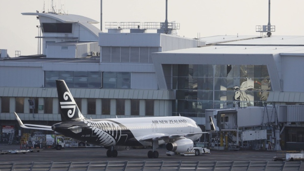 An Air New Zealand Ltd. aircraft sits at the International Terminal of Auckland Airport in Auckland, New Zealand, on Tuesday, July 7, 2020. New Zealand’s government will limit the number of citizens flying home with the national airline to reduce pressure on its overflowing quarantine facilities.