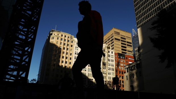 A pedestrian walks through Martin Place in Sydney, Australia, on Wednesday, June 3, 2020. Australia’s economy contracted in the first three months of the year, setting up an end to a nearly 29-year run without a recession as an even deeper slowdown looms for the current quarter. Photographer: Brendon Thorne/Bloomberg
