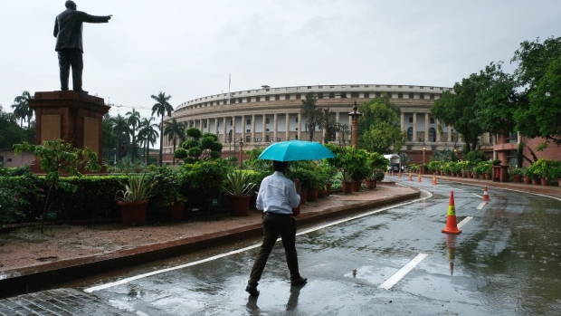 Parliament House on the opening day of the Monsoon session in New Delhi, India, on Monday, July 19, 2021. India's Prime Minister Narendra Modi's new cabinet is faced with the immediate challenge of boosting vaccine production to inoculate India's large adult population, while also reviving the pandemic-hit economy, which is just showing signs of recovery after a record contraction. Photographer. T. Narayan/Bloomberg
