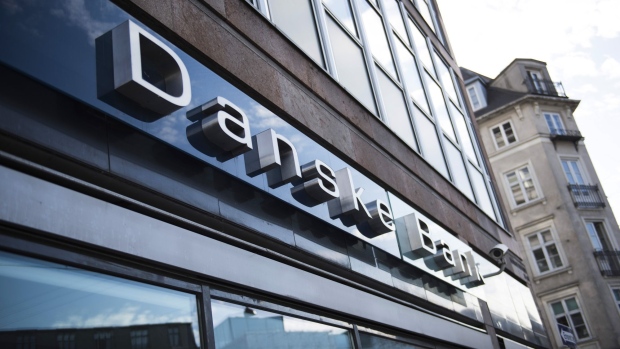 A logo sits on display outside a Danske Bank A/S bank branch in central Copenhagen, Denmark, on Wednesday, Sept. 19, 2018. Danske Bank A/S Chief Executive Officer Thomas Borgen will step down amid allegations his bank was at the center of a major European money laundering scandal with as much as $234 billion flowing through a tiny unit in Estonia. Photographer: Freya Ingrid Morales/Bloomberg