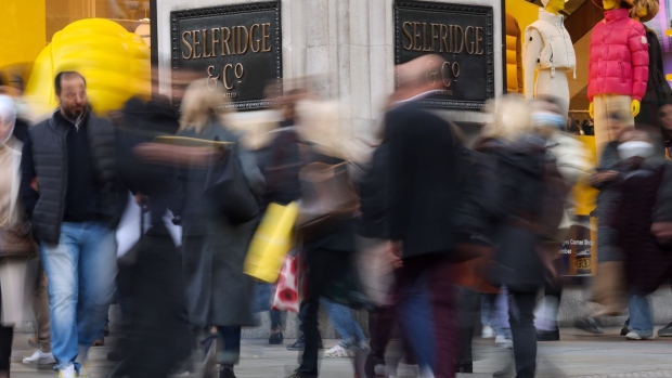 Pedestrians pass Selfridges & Co. Ltd. department store on Oxford Street in London, U.K., on Wednesday, Nov. 17, 2021. The U.K. Office for National Statistics are due to release their latest retail figures on Friday.