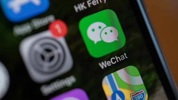Tencent Holdings Ltd.'s WeChat app icon is arranged for a photograph on a smartphone in Hong Kong, China, on Friday, Aug. 7, 2020. President Donald Trump signed a pair of executive orders prohibiting U.S. residents from doing business with the Chinese-owned TikTok and WeChat apps beginning 45 days from now, citing the national security risk of leaving Americans' personal data exposed.
