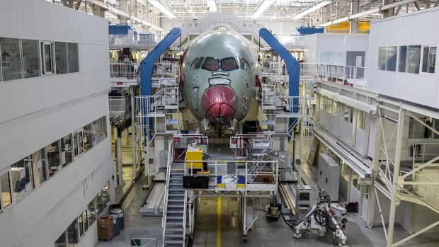 An Airbus A350 XWB passenger aircraft stands on the final assembly line at the Airbus factory in Toulouse, France. Photographer: Balint Porneczi/Bloomberg